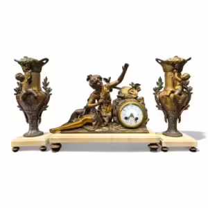 A set of 3 pieces, a clock and two statues, bronze colour